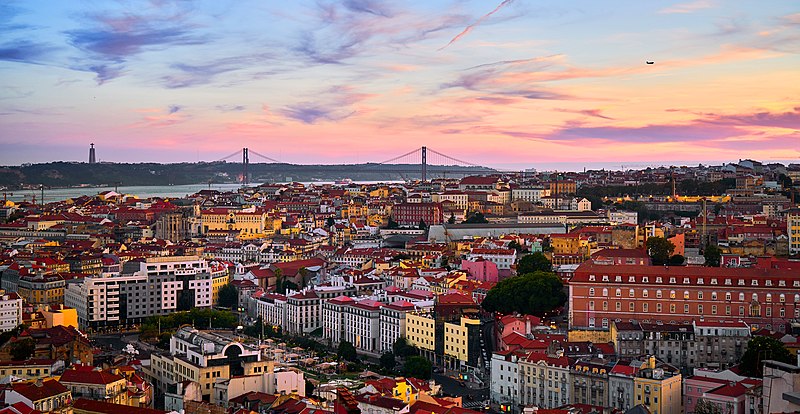 Lisbon rooftops and the Tagus River at sunset